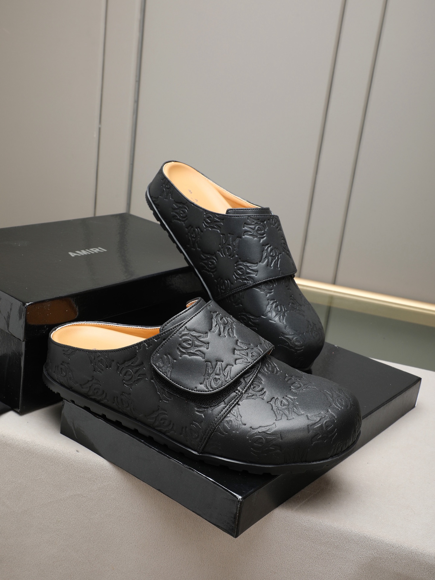 Ami embossed mules
