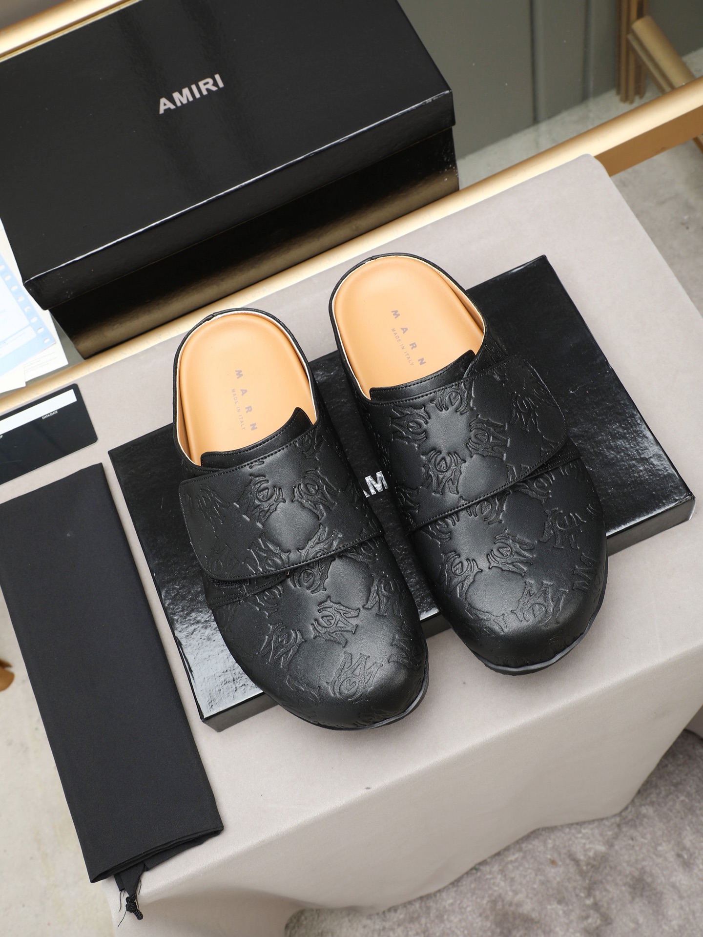 Ami embossed mules