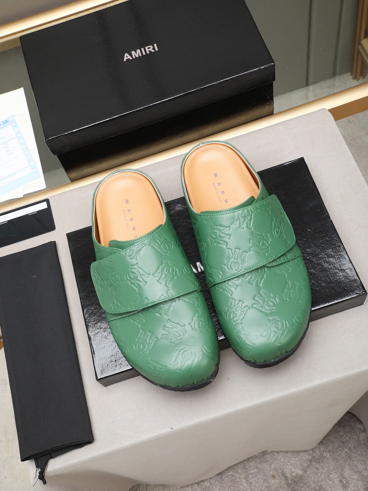 Ami embossed mules