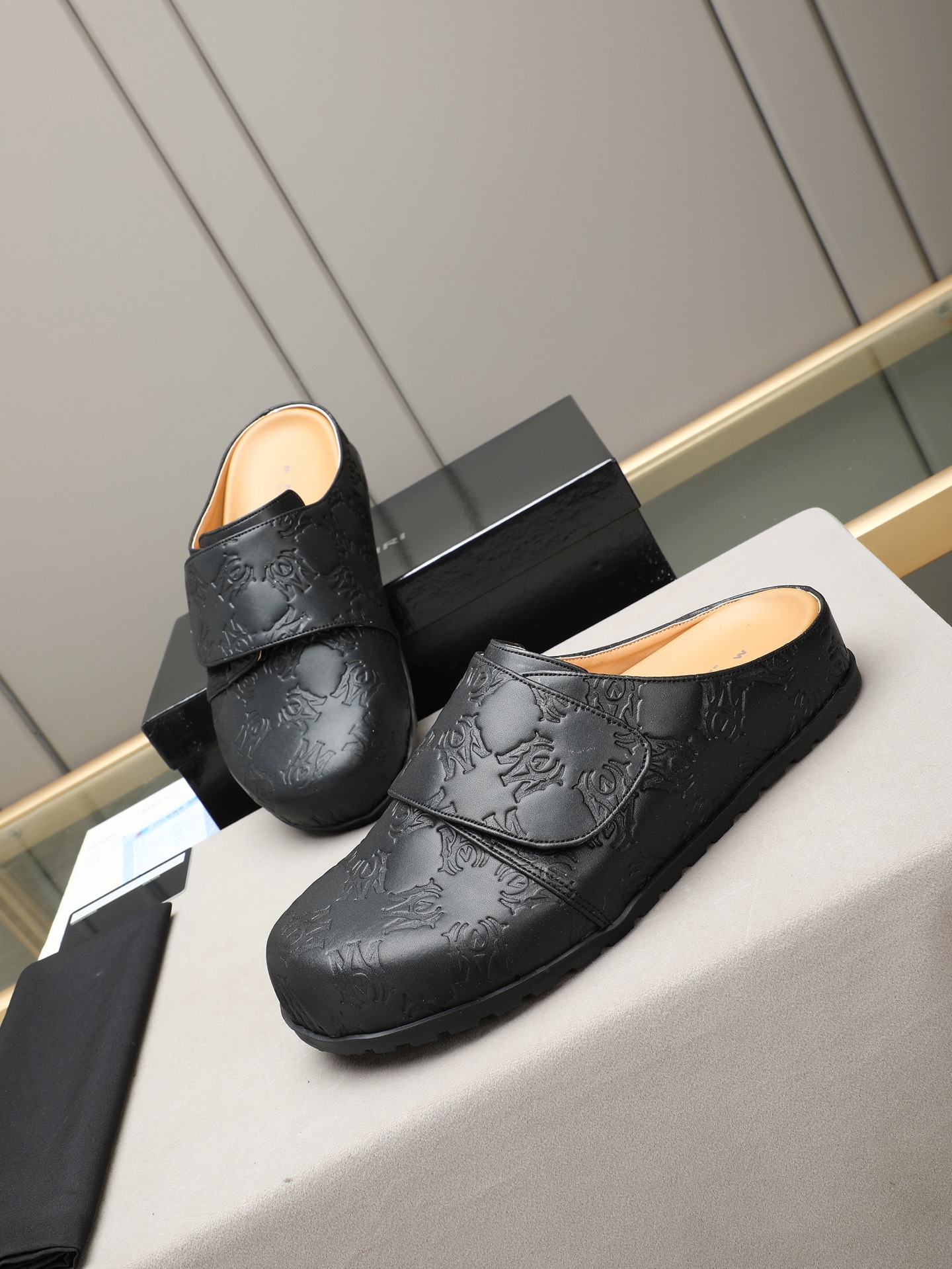 Ami embossed mules